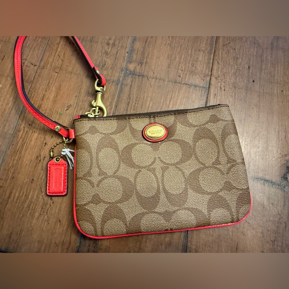 Coach Tan Monogram With Coral Trim Wristlet.  Excellent Condition.